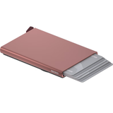 Secrid Cardprotector for MagSafe with open rose-colored card holder showing slots for credit cards and magnetic attachment