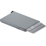 Secrid Cardprotector for MagSafe in titanium, open to show card slots and magnetic attachment for iPhone compatibility.