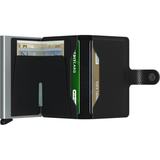 Secrid Miniwallet Rango in black, open to show compact design and card slots, made of leather.