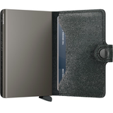 Secrid Miniwallet in black with star design, compact leather wallet featuring card slots and a sleek, stylish appearance.