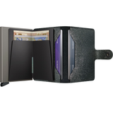 Secrid Miniwallet with star pattern in black, open to show card slots and interior design, compact and stylish wallet.