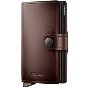 Secrid Premium Miniwallet Dusk in MDU brown leather, front view showing sleek compact design and card slots.