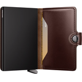 Secrid Premium Miniwallet Dusk in brown leather with card slots and compact design, showing the wallet's textured surface.