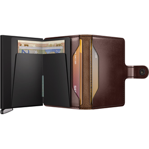 Secrid Premium Miniwallet Dusk open showing brown leather interior and card slots, compact metal design for secure card storage.