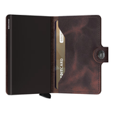 Secrid Miniwallet in vintage chocolate open, showing card slots and compact leather design for secure everyday use.
