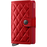Secrid Premium Miniwallet Emboss in medium red, front view showing textured embossed leather and compact design.