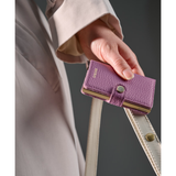 Secrid Miniwallet Pebble leather wallet with card slots and compact design, shown in a home lifestyle setting.