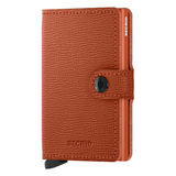 Secrid Miniwallet Crisple in pumpkin orange with front view, compact leather wallet with card slots and sleek design.