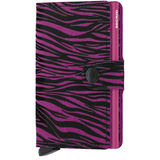 Secrid Miniwallet in fuchsia flocked leather showing front view with card slots and sleek compact design.