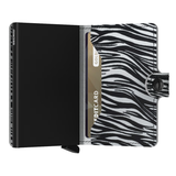 Secrid Miniwallet in flocked light grey leather showing compact design with card slots and smooth textured surface.