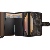 Open Secrid Miniwallet Jungle in brown leather showing card compartments and compact wallet design.