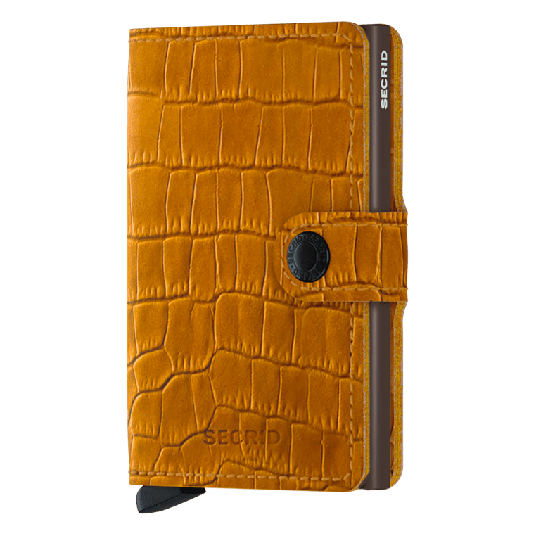 Secrid Miniwallet Cleo in ochre brown with front view showing compact leather wallet design and branding.