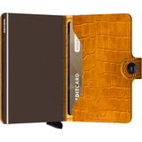 Secrid Miniwallet Cleo in ochre brown leather, compact wallet with card slots and sleek design for everyday use.