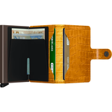 Secrid Miniwallet Cleo in ochre brown open, showing card slots and compact leather design for secure everyday use.