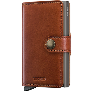 Secrid Texano Miniwallet with saddle-colored leather front view showing compact design and card slots.
