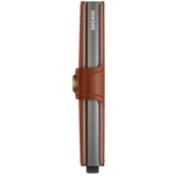 Secrid Miniwallet Texano with saddle-colored leather, showing front and side view of compact card and cash wallet.