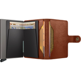 Secrid Miniwallet Texano open showing card slots and sleek leather design in saddle color