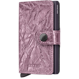 Secrid Miniwallet Crunch in pink, compact leather wallet with card slots and metal card protector on front.