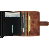 Secrid Miniwallet in Dutch-Martin whiskey leather, open to show card slots and cash compartment, compact and stylish design.