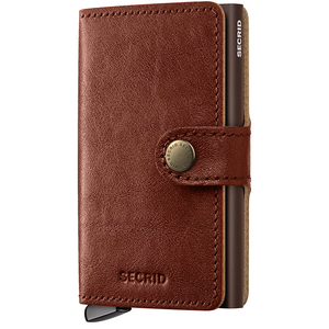 Secrid Premium Miniwallet Basco featuring a sleek whiskey-colored leather exterior and compact design for secure card storage.
