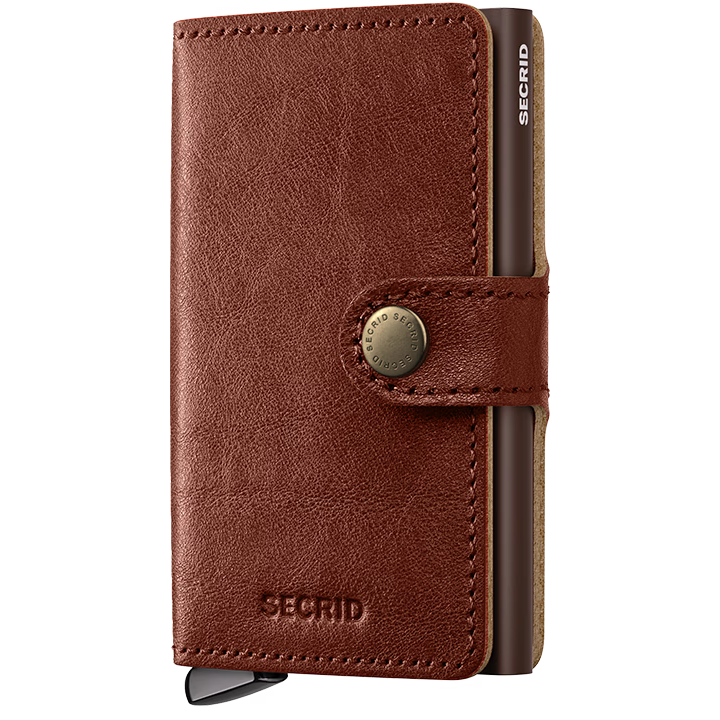 Secrid Premium Miniwallet Basco featuring a sleek whiskey-colored leather exterior and compact design for secure card storage.