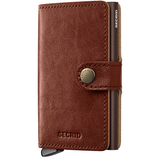 Secrid Premium Miniwallet Basco featuring a sleek whiskey-colored leather exterior and compact design for secure card storage.