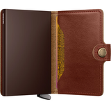 Secrid Premium Miniwallet Basco with whiskey-colored leather and compact design, featuring card slots and sleek craftsmanship.