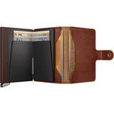 Secrid Premium Miniwallet Basco open with multiple card slots and cash compartment, showcasing sleek leather design.