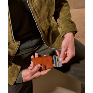 Secrid Premium Miniwallet Basco with whiskey-colored leather and compact design, featuring card slots and secure RFID protection.