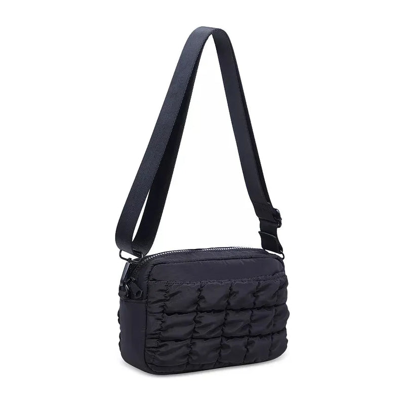 Black Sol & Selene quilted nylon crossbody bag with adjustable strap and sleek design, perfect for casual outings.