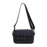 Black quilted nylon crossbody bag by Sol & Selene with sleek design and adjustable strap, ideal for everyday use.