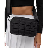 Black Sol & Selene quilted nylon crossbody bag with adjustable strap and compact design for everyday use.