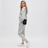 Black Sol & Selene Divide & Conquer quilted crossbody bag with adjustable strap and sleek design.