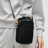 Sol & Selene quilted crossbody bag in black with a sleek design, featuring a compact and stylish look for everyday wear.