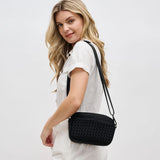 Sol & Selene woven neoprene crossbody bag in black, featuring a stylish and durable design with adjustable strap and modern look.