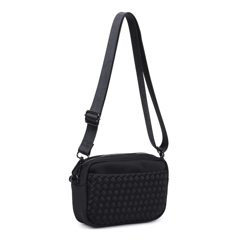 Black Sol & Selene woven neoprene crossbody bag with adjustable strap and modern design.