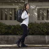 Thule Subterra 2 backpack, 21L capacity, black with padded shoulder straps and front zip pocket, designed for everyday use.