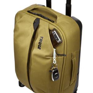 Thule Aion carry-on spinner luggage with four wheels, durable hard shell, and integrated handle for easy travel.