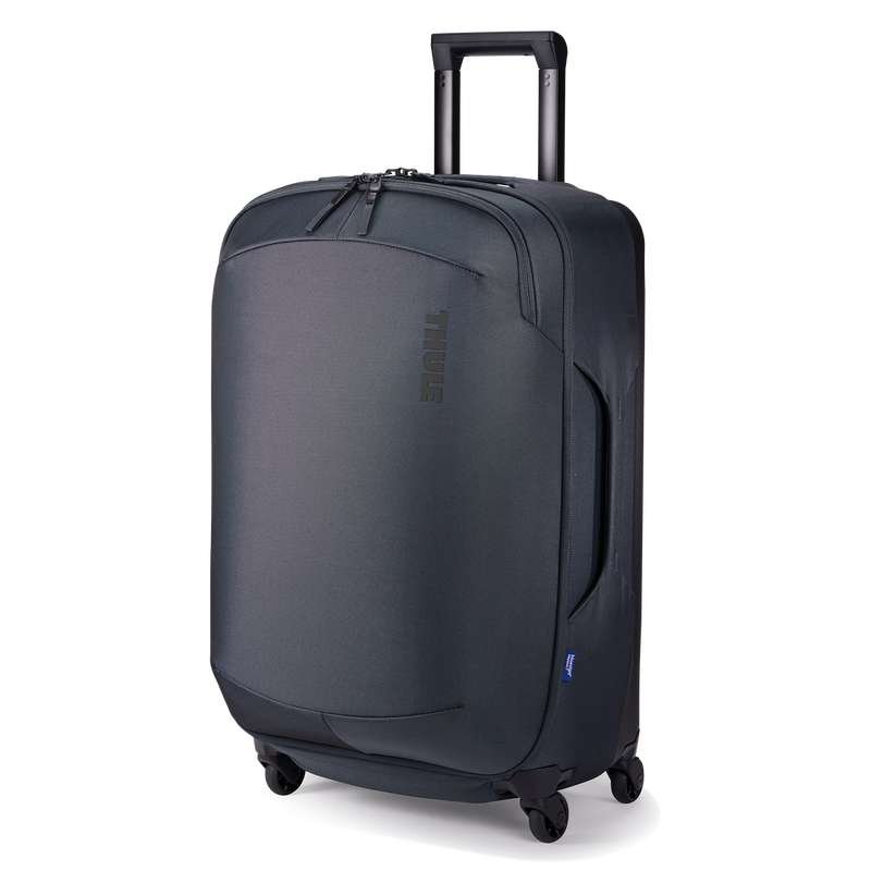 Black Thule Subterra 2 checked spinner luggage with 65L capacity, featuring durable wheels and a sleek, hard-shell design.