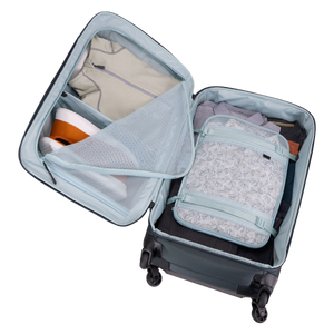 Black Thule Subterra 2 checked spinner luggage with 65L capacity, durable hard shell and four spinner wheels for easy travel.