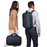Dark slate Thule Subterra 2 hybrid travel bag, convertible bag with multiple compartments and padded handles for easy carrying.