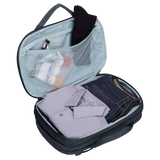 Thule Subterra 2 hybrid travel bag in dark slate, convertible design with multiple compartments and padded handles for easy carrying.