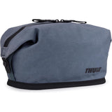Thule Aion toiletry bag with multiple compartments and zipper closures, made of durable material for travel organization.