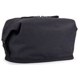 Thule Aion Toiletry Bag in black, made from durable material with a zipper closure and multiple compartments for travel essentials.