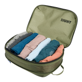 Thule Compression Cube Set packing organizers in white, designed for efficient travel organization and space-saving.