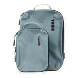 Thule Compression Cube Set of packing organizers in white for efficient clothing storage and travel organization.