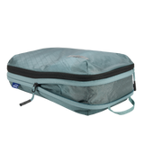 White Thule Compression Cube Set packing organizers for efficient luggage packing and space management.
