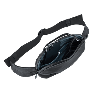 Thule Aion sling bag showing a compact, stylish black sling with adjustable strap and organizational compartments.