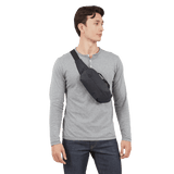 Thule Aion sling bag with adjustable strap and multiple compartments, designed for carrying essentials comfortably.