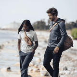 Thule Aion sling bag showing its compact design with adjustable strap and multiple compartments for daily essentials.